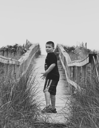 Ethan walking on bridge in Maine.